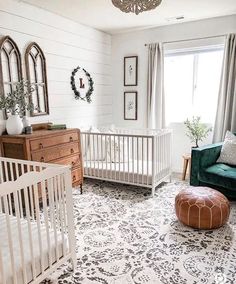 a baby's room with white walls and furniture