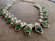 "Gorgeous mid century choker, gold plated, set with two color of alternate green rhinestones.The stones are faceted and follow the light. Simple, elegant, and not overly sparkly. Easy to wear today.  Length 15.5\"  adjustable. Width .5\"" Follow The Light, Choker Gold, Rhinestone Choker Necklace, Choker Necklace Set, Rhinestone Choker, Santa Fe Nm, Emerald Necklace, Wedding Jewellery Necklace, Gifts For My Sister