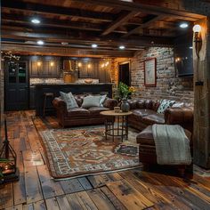 a living room filled with furniture and wooden flooring next to a brick wall covered in lights