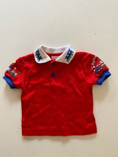 "Adorable vintage train theme OshKosh polo shirt.  Two buttons at the neckline.  Great graphics on each sleeve and collar.  Nice and soft.  Excellent vintage condition - colors are bright as if new.   label:  OshKosh fabric:  cotton/poly blend size:  labeled size is 3-6 months.  Looks to be closer to 3 months.  Please check measurements for an accurate fit.  Questions are welcome! shirt was measured across the front side lying flat underarm to underarm 10\" length from top of shoulder 11 1/2\" shoulder 9 1/2\"" Train Theme, 90s Baby, Printed Polo Shirts, Vintage Train, Toddler Clothes, Clothes Accessories, Vintage Baby, Kids Tops, Toddler Outfits