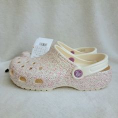 Bnwt And With The Hanger! Glitter Classic Clogs Color/Style Is Tagged As Glitter Clog K Bur It's A Mix Of Pink/Silver/Cream Size Is J5 Could Also Fit A Womens 6 Or 7 I Am A Size 7 And I Can Fit These! B1 Casual Flat Glitter Sandals, Casual Glitter Sandals For Spring, Casual Party Clogs For Spring, Spring Party Casual Clogs, Casual Glitter Sandals With Synthetic Material, Casual Glitter Synthetic Sandals, Casual Round Toe Clogs For Party, Classic Crocs, Crocs Pink