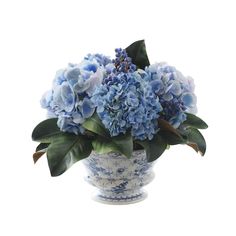 a blue and white vase with flowers in it