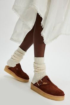 An effortless everyday pair, these mules from Clarks feature premium suede uppers, sat on a slightly wedged platform crepe sole with a buckle and fob detail for added accents. **Features:** Slip-on style, backless design, round toe, suede uppers, center seam, buckle detail, attached fob, slight wedge, platform crepe rubber sole **Why We | Clarks Trek Wedge Mules at Free People in Brown, Size: US 8.5 Mules Shoes Outfit, Mule Shoes Outfit, Wedge Mules, Suede Mules, Mama Style, Backless Design, Casual Chic Outfit, Leather Mules, Clogs Shoes