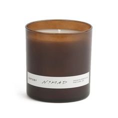 a brown candle with a white label on the top and bottom that says, nomap