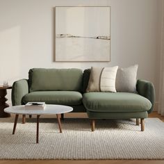 a living room scene with focus on the couch and coffee table in the foreground