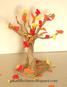 a tree made out of paper with leaves on it