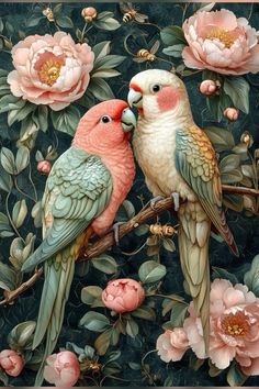 two birds are sitting on a branch with pink flowers