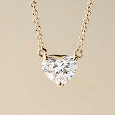 Add some dazzling romance to your style with this lovely 1.00 or 2.00 carat heart-shape lab-grown diamond necklace from Peace Jewelers. You'll love the gorgeous sparkle on your neckline! The piece is finely crafted in your choice of rich 14K yellow or white gold with a polished finish. The 18" cable link chain secures with a lobster clasp. Pair it with matching earrings 215-188 to create a stunning coordinated style. Diamond Necklaces, Necklace Size, 2 Carat, Necklace Sizes, Heart Shape, Link Chain, Matching Earrings, Lab Grown, Lab Grown Diamonds