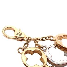 About This Piece: This rare Louis Vuitton charm pendant features three keys, each crafted from 18k gold in three distinct colors: yellow, white, and rose. The rose gold key is elegantly adorned with red enamel to form a heart shape, showcasing LV's exqmbolic pieuisite attention to detail. A luxurious and syce, it embodies love and sophistication. Metal: 18k Yellow, Rose, and White Gold  Size: 38mm Total Each key is 8mm wide  Weight: 5.4 grams  Hallmarks: LV 750   Please refer to the dimensions in the description above for accurate measurements. Please reach out to the seller with any questions on dimensions or fit prior to purchase. Elegant Pendant Charms With Logo, Elegant Pendant Logo Charm, Elegant Logo Charm Pendant, Luxury White Gold Charms For Gift, Luxury Yellow Gold Pendant Charms, Luxury White Gold Necklace With Charms, Luxury Yellow Gold Charms With Removable Details, Luxury Yellow Gold Charms With Removable Features, Luxury Yellow Gold Charms With Removable Pieces