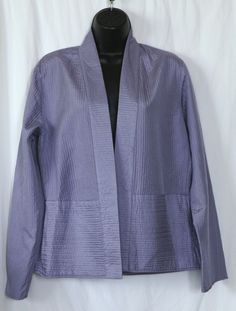 Eileen Fisher is known for sumptuous fabrics and this is no exception. It's substantial yet lightweight and always looks beautiful. The color is perfect in spring and unexpectedly refreshing in fall, while the style is timeless and goes with a simple black dress as well as it does with a cashmere shell and jeans. 
 #EileenFisher  #Silk  #Purple Elegant Lavender Outerwear For Spring, Lavender Outerwear For Spring Workwear, Fitted Lavender Outerwear For Spring, Casual Purple Summer Outerwear, Casual Purple Outerwear For Summer, Long Sleeve Purple Summer Outerwear, Purple Long Sleeve Summer Outerwear, Lavender Fitted Tops For Daywear, Fitted Lavender Tops For Daywear