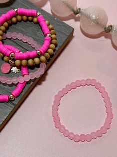 This pink stack of brackets from Byrd and Bead is perfect for spring and summer. Each bracelet sold separately. Pictured: - Heishi Hot Pink and Gold beads bracelet - Solid Light Pink beaded bracelet - Hot Pink Smiley wooden bracelet Cheap Pink Wristband With Colorful Beads, Cheap Pink Beaded Bracelets For Friendship, Pink Beaded Bracelets For Summer, Cheap Pink Beaded Bracelets For Summer, Cheap Pink Beaded Bracelets For Spring, Pink Beaded Bracelets For Spring, Gold Beads Bracelet, Smiley Daisy, Pink Beaded Bracelet