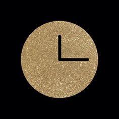 a gold clock face with the time on it's left hand side and black background