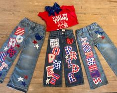 three american flags and stars on jean pants, one with an american flag t - shirt