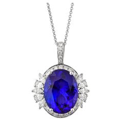 This collection features a selection of the most tantalizing Tanzanites. This enchanting East African gemstone can only be procured from one mine in the foothills of Mount Kilimanjaro, Tanzania. We have accented the rich purple-blue hues of this gemstone with diamonds set in white gold to present a rich and regal look. Classic tanzanite pendant in 18K white gold with diamonds. Tanzanite: 15.80 carat oval shape, 17.02 X 13.05mm size. Diamonds: 1.395 carat, G colour, VS clarity. Gold: 5.07g, 18K w Kilimanjaro Tanzania, Riviera Necklace, Tanzanite Pendant, Mount Kilimanjaro, Rich Purple, Rare Gems, Naha, Stone Collection, Color Stone