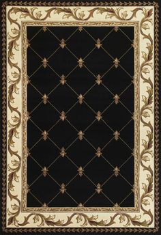 a black rug with gold and white designs on it