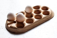 an egg tray with six eggs in it