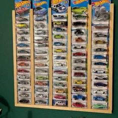 a wall mounted toy display with cars on it