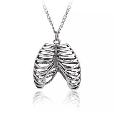 Rib Cage Pendant Necklace – COLDLINE CLOTHING Cage Pendant Necklace, Diy Braided Bracelet, Caged Necklace, Mens Jewelry Necklace, Necklace Shop, Rib Cage, Shell Necklaces, Braided Bracelets, Trendy Accessories