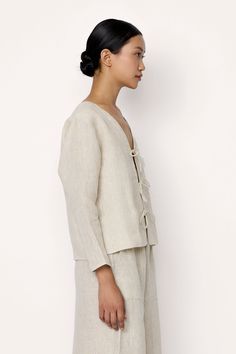 Introducing our Tie Front Blouse, a sophisticated sustainable staple for any wardrobe Crafted from organic linen, this shirt exudes effortless style. Pair it effortlessly with our Everyday Pant for a laid-back look. Made with organic Linen Lined with organic cotton Handmade in India Machine wash cold, lay flat to dry, warm iron as needed. Honoring Earth + Maker Our wovens are handcrafted in India, preserving age-old textile traditions. Made in beautiful, family-operated studios under safe workin Spring Flax Relaxed Fit Blouse, Spring Linen Blouse For Work, Spring Linen Loungewear Blouse, Spring Linen Blouse In Flax Color, Effortless Linen Blouse For Work, Versatile Linen Blouse For Work, Flax Blouse For Spring Workwear, Spring Workwear Blouse In Flax Color, Spring Workwear Flax Blouse