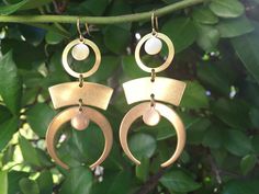 "These beautiful brass STATEMENT earrings were created with a mixture of brass geometric shapes and brass charms. These lightweight earrings hang beautifully from 24k gold plated ear wires and measure 2 1/2 inches in length and 1 inch wide at widest point. These earrings make the \"perfect gift\" for your mom, sister, daughter, friend, girlfriend, wife or bridesmaids....She will truly love these and treasure them for many years to come. ~All of my listings are handmade with love and ready to shi Bohemian Brass Linear Earrings For Pierced Ears, Bohemian Geometric Nickel-free Jewelry, Bohemian Geometric Earrings With Ear Wire, Bohemian Metal Linear Earrings, Bohemian Metal Linear Earrings For Pierced Ears, Modern Gold Earrings, Friend Girlfriend, Earrings Geometric, Brass Charms