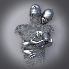 two silver metal figures hugging each other