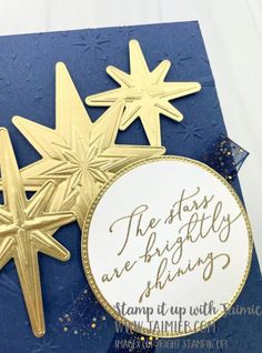 a close up of a card with gold stars on it and the words, the stars are brights are shining