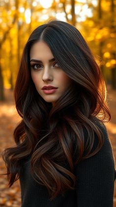 7 Fall-Inspired Brunette Hair Color Ideas Dark Hair Hazel Eyes Women, Bronze Brunette Hair, Fall Hair Color Trends For Brunettes, Warm Fall Hair Color, Curled Brown Hair, Natural Brown Hair Color, Wavy Brunette Hair, Highlights Golden