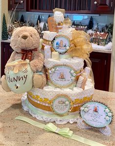 a teddy bear sitting on top of a cake with other items in front of it