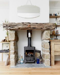 a wood burning stove sitting inside of a living room