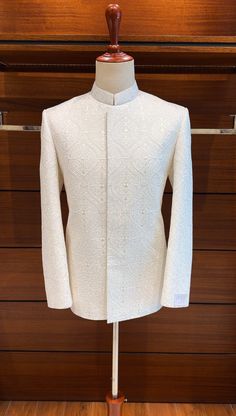 For the discerning groom, we present our opulent Off White Prince Coat. The base fabric is made of fine silk and is exquisitely unique due to the delicate floral embroidered design on it. This fabric, which is one of the best and rarest materials out there, will give your special day a hint of opulence. Adjustable to Your Desires You can alter the color and style of this amazing coat to fit your preferences. Our dedication to superior quality guarantees that each and every detail is flawless, re Prince Coat Design For Men, Prince Coat For Men, Marriage Outfit, India Fashion Men, Niqabi Bride, Indian Wedding Suits Men, Jodhpuri Suits, Jodhpuri Suits For Men, Prince Coat