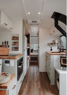 the interior of an rv is clean and ready to be used as a kitchen area