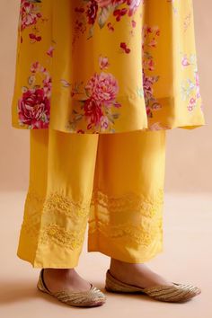 Yellow silk kurta featuring digitally printed florals with pleating details at the front and back. Paired with a hand embroidered tonal pant in pure silk.
Components: 2
Pattern: Printed
Type Of Work: Floral
Neckline: Round
Sleeve Type: Pleated
Fabric: Silk
Color: Yellow
Other Details: 
Kaftan length: 42 inches
Model Height: 5ft 9inches, wearing size S
Occasion: Mehendi and Haldi - Aza Fashions Silk Kurta, Yellow Silk, Pleated Fabric, Fabric Silk, Pant Set, Set For Women, Aza Fashion, Model Height, Pure Silk