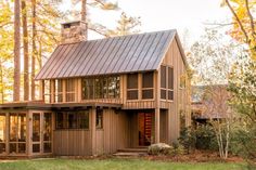 a small wooden house sitting in the middle of a forest