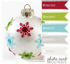 a white ornament with snowflakes on it's side and the names below