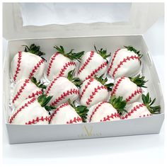 a box filled with white chocolate covered strawberries