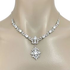 "A glamourous semi parure Victorian wedding vintage style bridal jewelry set with cz dangle earrings and statement necklace featuring intricately detailed Fleur de Lis Damask royalty inspired motifs. They are made of high quality clear cubic zirconia with earrings on sterling silver posts, all framed in white gold silver rhodium tarnish-resistant finish. Earrings are 1 3/8\" (3.5cm) including cz-studded sterling silver posts. Necklace length is adjustable at min 16.5\" (42cm) and max 18.5\" (47c Vintage Bridal Necklace, Gatsby Jewelry, Statement Necklace Wedding, Bridal Accessories Jewelry, Victorian Wedding, Wedding Vintage, Cz Jewelry, Bridal Bracelet, Wedding Jewellery Necklace