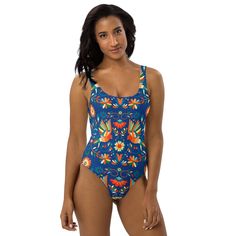 Inspired by the captivating artistry of Mexican Otomi designs, our One-Piece Swimsuit is a splash of culture for your beach days! Against a deep blue backdrop, the colorful design adds flair to your swimwear collection. Dive into style and make waves with every wear! This one-piece swimsuit for all figures will bring out your best features. Enjoy the smooth fabric and the flattering design, and show it off by the sea or pool! Otomi Art, Mexican Otomi, Blue Backdrop, Blue Backdrops, Make Waves, Swimsuits For All, Colorful Design, Beach Days, Swimwear Collection