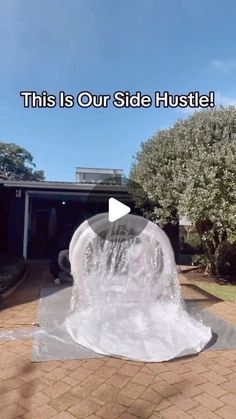 an inflatable water fountain is shown with the caption'this is our side hustle '