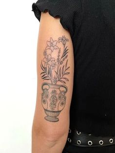 Plant tattoos are a popular tattoo design because they're simple to draweasy to hide and can be incorporated into many different styles. Pot With Flowers Tattoo, Plant Tattoo Women, Flower In Pot Tattoo, Plant In Vase Tattoo, Plant Pot Tattoo, Potted Plant Tattoo, Plant Tattoos For Women, Plant Tatoos, Garden Tattoo Ideas