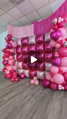 balloons and streamers are arranged in the shape of a house