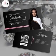 a black and white business card with diamonds on the back, featuring a woman's face