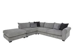 a gray sectional couch with black pillows and grey throw pillows on the bottom half of it