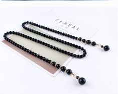 "Elegant Pearl Waist Chain for Dress, Silver Bridal Belt, Black Beaded Belly Chain for Girl Outfit, No clasp, Gift for Her The chain was designed without a clasp that you can freely make a knot. It is good to be used as waist belt, long necklace, even back chain. Material: 6mm, 8mm Imitation Pearl-High Luster Hard Plastic Pearl Adjustable: Yes *Pearl Color: White, Cream, Black *Metal Color: Silver, Gold.  **How to order: 1) Please choose your finish from drop-down menu 2) Please select your chain size. The chain is adjustable.  Measured from end to end included clasp and pearl pendant.   S- up to 36\" M-up to 40\" L- up to 44\" XL-up to 50\" **Shipping: An order will be shipped via a letter mail.  For American customers, it will be arranged by USPS; For Canadian customers, it will be arran Pearl Waist Belt, Beaded Belly Chain, Pearl Waist Chain, Back Chain, Dress Silver, Bridal Belt, Belly Chain, Waist Chain, Belt Black