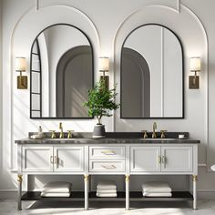 a bathroom with two sinks and mirrors on the wall next to a potted plant