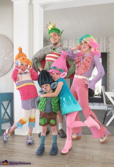 a group of people in costumes posing for a photo