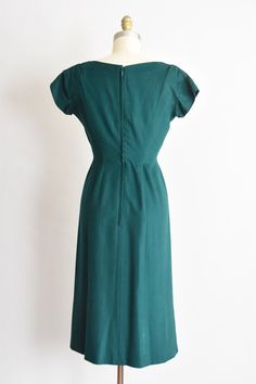 "Timeless 1950s designer Pauline Trigère wiggle dress. Hunter green soft wool. V collar with weight in lining, princess seamed waist, double darted bust and capped sleeves. Pleats at shoulders. Straight skirt with box pleat hem. Lined in silk. Back metal zipper closure. So thoughtfully tailored. State of garment | very good, light wear under both arms and a few tiny pin holes in the lining. refer to photos. Measurements ✂--- Best fit | Medium Bust | 36\" Shoulders | not specified Shoulder to wai 1950s Home, 1950s House, Valentine Dress, Green Soft, Capped Sleeves, Holiday Dress, Wiggle Dress, Straight Skirt, Kimono Dress