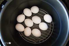 eight eggs are sitting in an air fryer