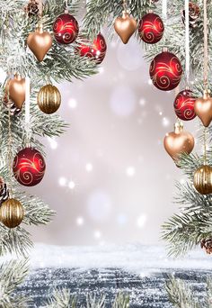 a christmas tree with ornaments hanging from it's branches and snow on the ground