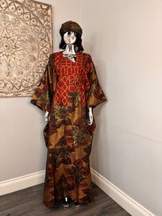 African/Nigeria bubu brocade outfit. One size. Small sized scarf. Oversized,And  Please note measurements: Width: 64inches Lenght: 62inches Bohemian Long Abaya For Traditional Ceremonies, Festive Long Brown Kaftan, Traditional Brown Kaftan With Kimono Sleeves, Traditional Long Sleeve Kimono Free Size, Traditional Long Sleeve Free Size Kimono, Long Kaftan With Traditional Patterns For Festive Season, Long Festive Kaftan With Traditional Patterns, Festive Long Kaftan With Traditional Patterns, Brown Long Free Size Kaftan