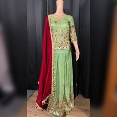 Green maroon lehenga available in size M Reception Long Skirt Sharara With Dupatta, Pista Green Palazzo Set For Party With Traditional Drape, Party Sharara In Pista Green With Cutdana, Pista Green Cutdana Sharara For Party, Pista Green Sharara For Navratri Party, Pista Green Festive Sharara For Party, Festive Pista Green Sharara For Party, Chanderi Choli In Pista Green For Party, Party Choli In Pista Green Chanderi